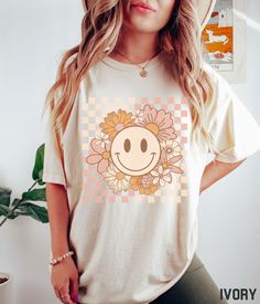 Smiley Face Shirt, Flower Shirt, Retro Smile Face, Trendy Vintage Graphic Tee, Checkered Comfort Colors T-shirt, Plus Size Happy Face Tshirt - Etsy Playful Smiley Face Tops For Spring, Cute Spring Tops With Smiley Face, Cute Smiley Face Tops For Spring, Cute Smiley Face Top For Spring, Short Sleeve Tops With Smiley Face For Spring, Spring Tops With Smiley Face, Short Sleeve, Spring Smiley Face Short Sleeve T-shirt, Smiley Face Shirt, Bella Canvas Tees