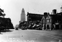 an old black and white photo of a city street