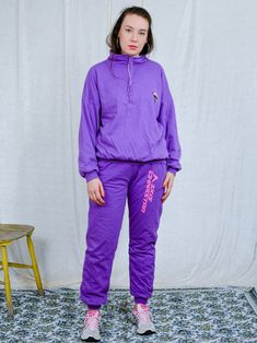 "AUNT GERTRUDE PRESENTS - vintage 90's purple tracksuit - brand: Skis Dynastar - lined, insulated - material: 100% cotton CONDITION (1-10 ❶❷❸❹❺❻❼❽ Good vintage condition SIZE/MEASUREMENTS size from label: XL TOP chest: 52 inches (132 cm) length: 23,5 inches (60 cm) sleeve length from armpit: 18 inches (46 cm) PANTS waist: 33-40 inches (84-102 cm) elastic waist hips: 44 inches (112 cm) rise: 12 inches (31 cm) length: 40 inches (101 cm) inseam: 30 inches (76 cm) The model is 5'9\" (174 cm), measur Purple Relaxed Fit Sweatpants For Athleisure, Purple Relaxed Fit Sporty Sweatpants, Purple Athleisure Joggers For Loungewear, Casual Purple Activewear For Loungewear, Sporty Winter Tracksuit For Jogging, Sporty Purple Sweatpants For Sports, Streetwear Tracksuit With Crew Neck, Winter Tracksuit Relaxed Fit For Gym, Winter Athleisure Tracksuit For Jogging