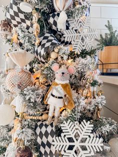 a christmas tree decorated with black and white ornaments