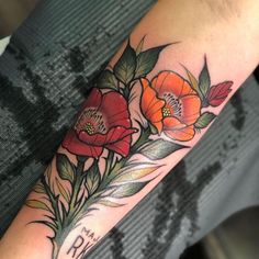 a woman's arm with flowers on it and the word no written in cursive writing