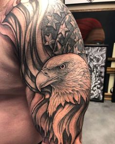 an eagle with stars on it's head and wings is shown in this tattoo design