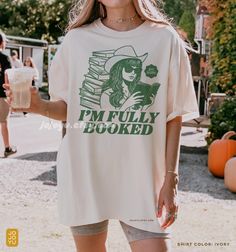 I'm Fully Booked - Comfort Colors Unisex T-shirt Bookish Retro Cowgirl Romance Thriller Tshirt, bookworm oversized shirt, book lover gift for teen friends readers Design by jojoyu. This item is made to order. If you want an oversized fit please size up one or two sizes! for reference, the model in the first photo is usually a medium but wearing XL for an oversized fit. Please note that the colors on the actual shirt might slightly differ from the photos. This is due to different color display on Summer Graphic Print Bookish T-shirt, Bookish Short Sleeve T-shirt For Spring, Spring Bookish Short Sleeve T-shirt, Spring Bookish Style Short Sleeve T-shirt, Bookish Style Letter Print Summer Tops, Spring Bookish T-shirt With Letter Print, Summer Bookish Tops With Letter Print, Bookish Short Sleeve Tops For Spring, Spring Bookish Short Sleeve Tops