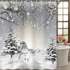 a shower curtain with a snowman and trees in the background on a snowy day