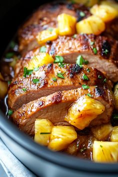 some meat and pineapples in a slow cooker