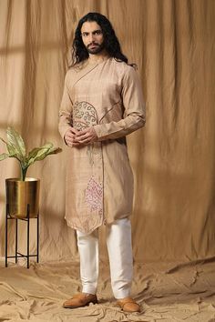 Beige asymmetric panel kurta with embroidery details. Paired with an off white pant. - Aza Fashions Diwali Embroidered Straight Kurta, Traditional Kurta With Embroidery For Diwali, Eid Fitted Kurta With Tonal Embroidery, Traditional Embroidered Kurta For Diwali, Traditional Festive Kurta With Embroidery, Traditional Long Sleeve Wear With Embroidery, Traditional Kurta With Embroidery For Eid, Fitted Traditional Kurta With Tonal Embroidery, Traditional Embroidered Kurta For Eid