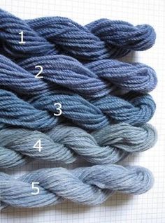 several skeins of yarn are shown with numbers on each skeine and the number