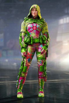 a woman dressed in green and pink is standing