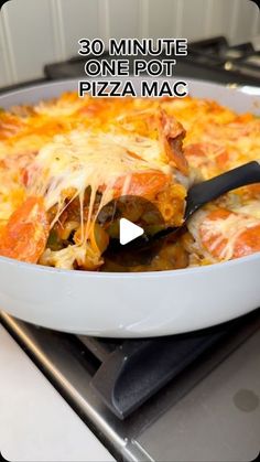 a pizza in a pan on top of a stove with the words 30 minute one pot pizza mac