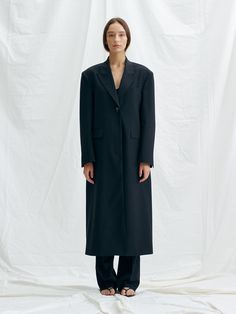 Editor's NotesThis is an oversized tailored coat from H8. It is made of a combined material and creates a structural shape with a solid texture. Recommend to wear with Mile Pants and setup.- Powerful post-processing on lightweight, small wool material- Built-in shoulder pads and hidden pockets.- Waist size can be adjusted with the belt on the back plate- H8 logo engraved cow horn button- Silk stitch detail*The color of the image may differ from the actual color depending on the resolution of you Modern Structured Outerwear, Modern Outerwear With Structured Boning, Oversized Notch Lapel Wool Coat For Formal Occasions, Oversized Wool Coat With Notch Lapel For Formal Occasions, Modern Structured Outerwear With Boning, Black Outerwear With Structured Boning For Work, Sleek Structured Outerwear With Boning, Black Outerwear With Structured Boning And Lapel Collar, Modern Structured Single Button Outerwear