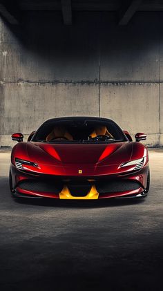 a red sports car parked in a parking garage