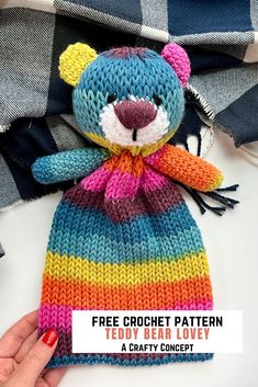 a hand holding a knitted teddy bear with the text free crochet pattern teddy bear love