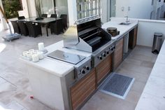 an outdoor kitchen with lots of counter space