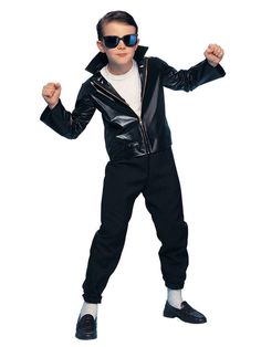 a young boy dressed in a black leather jacket and sunglasses, posing for the camera