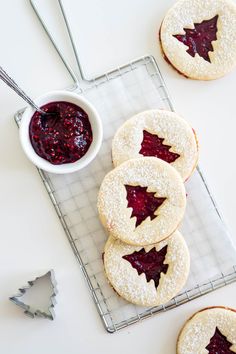 cookies with jam are on a cooling rack