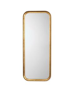 a gold framed mirror on a white wall