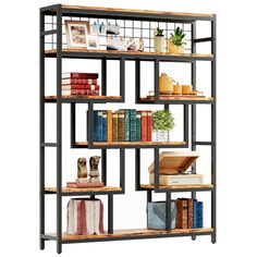 a book shelf with many books on top of it and some plants in the middle