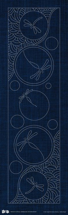 the back side of a blue book with white lines and swirls on it's cover