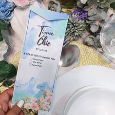 a person holding up an award for their time to care program in front of flowers