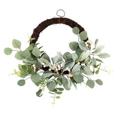 a wreath with green leaves and white flowers