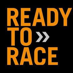 the words ready to race written in orange and black on a black background with an arrow