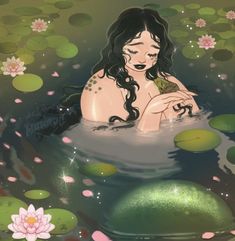 a woman sitting in the water with lily pads on her feet and holding a frog