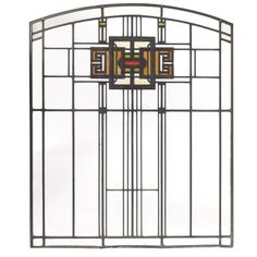 an art deco stained glass window with geometric designs