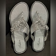 Size 8 Women’s Silver Sandals Only Tried On Never Worn. Nwot Silver Toe Post Sandals For Vacation, Silver Toe Post Flip Flops For Spring, Silver Flip Flops For Spring Beach, Silver Flip Flops For Spring Beach Outings, Silver Flip Flops For Beach In Spring, Silver Open Toe Synthetic Flip Flops, Silver Synthetic Open Toe Flip Flops, Party Silver Synthetic Flip Flops, Silver Open Toe Flip Flops For Party