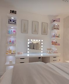 a bedroom with white furniture and lots of lights