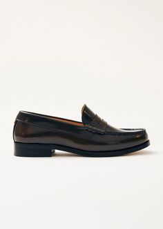 Brow penny loafers crafted from leather in a classic silhouette with coin-slot straps | Enjoy up to 30% off when you shop sustainable shoes on demand. Sustainable Shoes, Loafers Brown, Coin Slot, Brown Leather Loafers, Vegan Boots, Sustainable Leather, Office Shoes, Penny Loafer, Coffee Brown