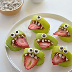 there are pictures of different food items with eyes and mouth designs on them, including strawberries