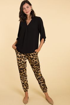 These chic joggers feature our favorite print ever - cheetah print!! Pants feature an elastic, pull-on waist, banded ankles, and side pockets. The woven fabric has a bit of a sheen that allows them to be dressed up for the office or styled casually. Chic Leopard Print Pants For Work, Chic Leopard Print Workwear Bottoms, Trendy Leopard Print Pants For Work, Casual Leopard Print Pants For Work, Casual Leopard Print Workwear Pants, Cheetah Print Pants, Animal Clothing, Blue Door, Print Pants