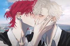 two people with red hair are kissing each other