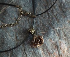 "Minimalist necklace with sculpted bronze rose. Material of rose is polymer clay with using gold leaf. Each petal of flower made by hand Dia flower about 15 mm/ 0.55 \" Length of necklace is adjustable: 18-20 inches/ 45,5- 50.8 cm If you need other length of necklace let me know and I will make it for you. Polymer clay isn't afraid of water, strong and non-toxic. Gorgeous gift for women and girls as handmade item ALL CHOKERS - https://www.etsy.com/shop/BuduartJewelry?ref=simple-shop-header-name& Nickel-free Rose Gold Copper Necklace, Adjustable Rose Gold Pendant Charm Necklaces, Adjustable Rose Gold Pendant Charm Necklace, Bronze Flower-shaped Jewelry Gift, Minimalist Bronze Necklaces For Gifts, Bronze Minimalist Necklace For Gift, Rose Gold Copper Necklace As Gift, Minimalist Handmade Rose Gold Necklace, Minimalist Bronze Necklace For Gifts