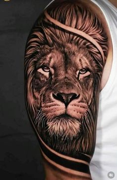 a man's arm with a lion tattoo on it, and his face is shown