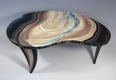 a wooden table with an unusual design on it