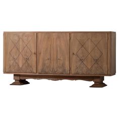 the sideboard is made out of wood and has diamond designs on the front door