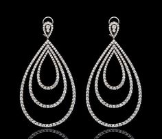 Our 18K White Gold Diamond Triple Loop Earrings are expertly crafted with a triple loop design and feature classic round brilliant cut Diamonds. These timeless earrings showcase your personal style and are a diamond-encrusted jewelry box essential. Teardrop Brilliant Cut Hoop Earrings For Formal Occasions, Diamond Accents Round Bridal Earrings For Evening, Round Bridal Earrings With Diamond Accents For Evening, Formal Round Chandelier Earrings With Prong Setting, Evening Bridal Earrings With Diamond Accents, Evening Diamond Round Earrings With Accents, Formal Cubic Zirconia Hoop Earrings With Elegant Design, Formal Diamond Round Chandelier Earrings, Luxury Platinum Earrings With Diamond Accents