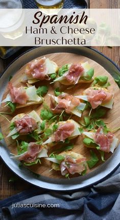 spanish ham and cheese bruschetta on a wooden platter