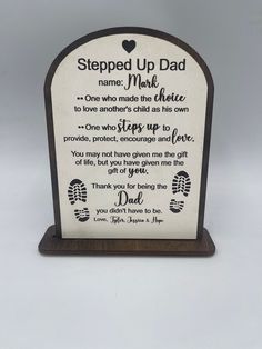 a wooden plaque with a poem on it that reads, stepped up dad and one who made the choice to love another's child as his own