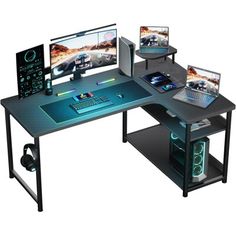 a computer desk with two laptops on it