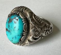 "we think this beauty is an Edwardian/Victorian revival ring, if not actually of those eras, and it's exquisite.  a beautiful blue turquoise set in a fancy bezel in a beautifully cast ring.  flowers and scrollwork, made in 800 silver.  this ring has a good bit of wear and has been sized.  the turquoise has held up well with some light scratching. marked 800 for the silver content. size:  measures a 7, might fit more like a 7.25 height of face:  between 11 and 12/16\" width of inner band:  just o Cast Rings, Victorian Revival, Blue Turquoise, Silver Turquoise, Turquoise Blue, Rings Statement, Beautiful Blue, Statement Rings, San Francisco