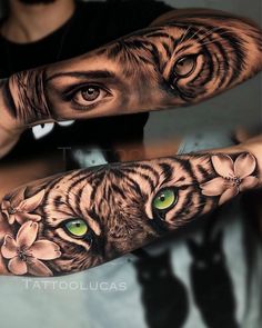 an arm tattoo with a tiger and flowers on it