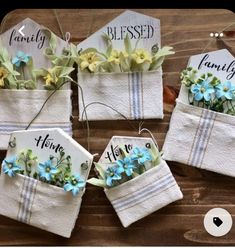 four white towels with blue and yellow flowers in them