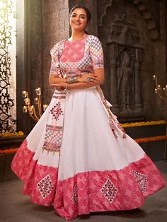 Adorn yourself with a unique look by wearing this gorgeous white lehenga for Navratri. This exquisite piece is made from high-quality cotton material, ensuring comfort and durability. It is beautifully decorated with intricate thread embroidery and all-over mirror work, adding a touch of elegance and charm to your outfit.
The white lehenga comes in a semi-stitched design, allowing you to adjust it up to 42 inches to ensure a perfect fit. It is accompanied by a jacquard cotton choli, designed wit White Lehenga Choli, Ghaghra Choli, White Lehenga, Georgette Lehenga, Indian Lehenga Choli, Navratri Chaniya Choli, Bollywood Lehenga, Lengha Choli, Lehenga Online