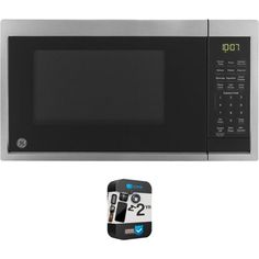 a microwave oven with the door open and an appliance next to it