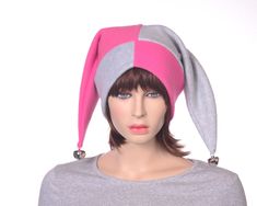 Two pointed harlequin style jester hat. Shoulder length droopy tails finished of with large 1 inch silver bells. Made from soft fleece. Split hat one side is Pink the other side gray. Double thick headband in contrasting color pattern. One size fits most 22-24 inch head. Ready to ship. Jester Costume, Thick Headbands, Jester Hat, Fleece Hats, Ren Fair, Costume Hats, Skull Cap Beanie, Polar Fleece, Skull Cap