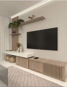 a living room with a flat screen tv on the wall