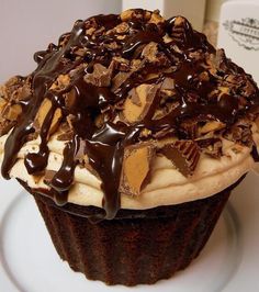 a cupcake with chocolate and peanut butter on top