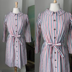 "Chic Vintage Late 1950s to 1960s Miss Juniorette White, Red, and Blue Striped Button Down Dress with sweet rounded collars and unique drawstring waist.  Laid flat, approximate measurements of garment with waist uncinched are: Bust: 38\" Waist  38\" Hips: 38\" Length: 37 1/2\"  mid shoulder to start of drawstring casing 15\" Shoulders seam to seam: 13 1/2\" Very good vintage condition. Held back from excellent to mint by a couple of teeny rust freckles and the slightest aura of blue on the fabri 1950s Collared Dresses With Buttons, Retro Vintage Dress With Buttons For Daywear, Retro Red Button-up Dress, Retro Button-up Dresses With Buttons, Retro Collared Dress With Button Closure, Retro Vintage Dress With Buttons, Vintage Red Button-up Dress, Striped Button Down Dress, White Camellia